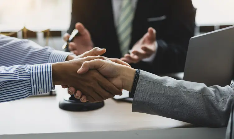 Business handshake after reaching an agreement