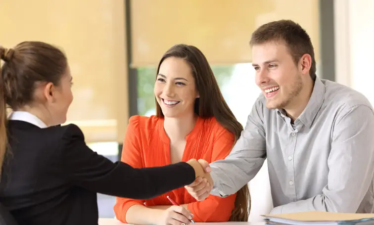 Couple meeting with a professional to discuss legal or real estate options