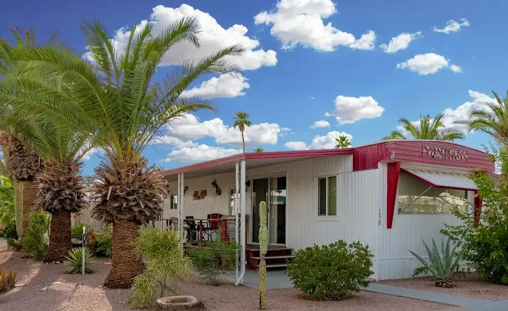 Single-story home with palm tree and front yard in a residential neighborhood