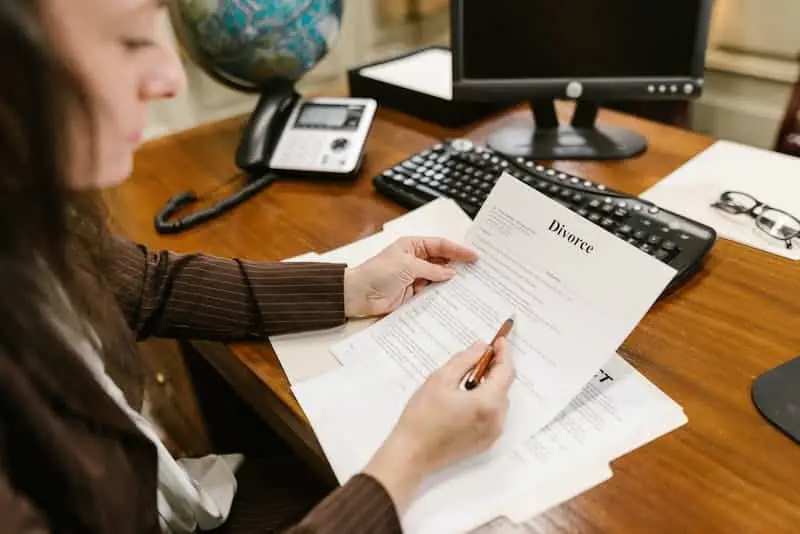 People reviewing documents during a mediation or legal meeting