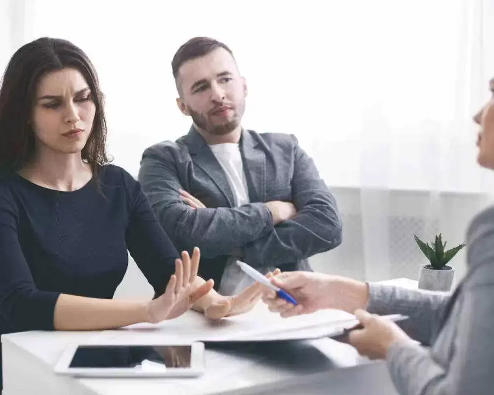 Couple meeting with a mediator to resolve a family dispute