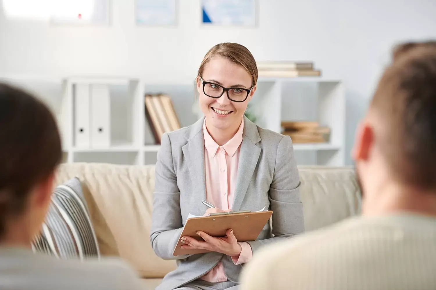 Woman working on laptop representing marketing strategies for psychologists