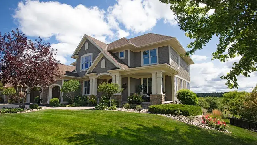 Modern suburban home exterior representing real estate listings