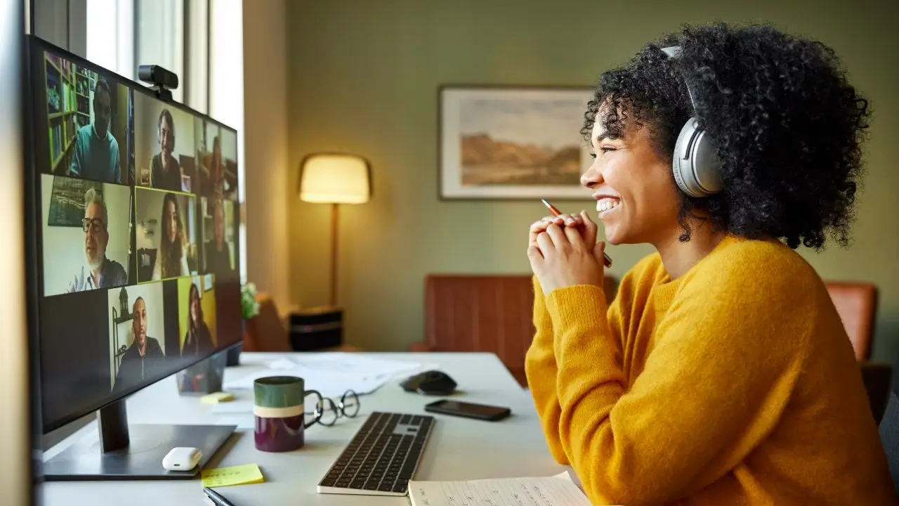 Person using laptop at home illustrating remote work influence on housing prices