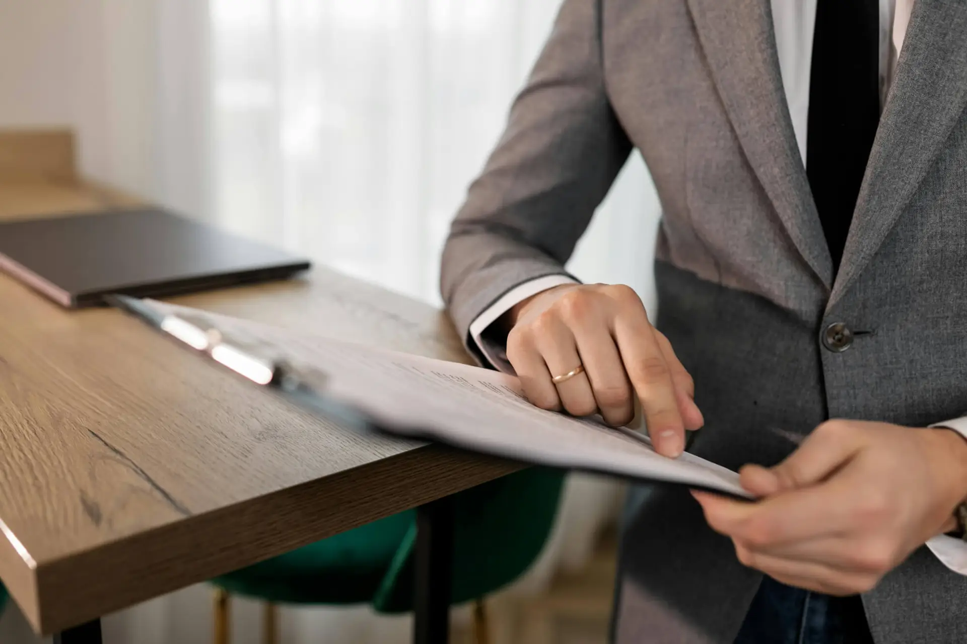 Person signing small estate affidavit documents for property or inheritance transfer